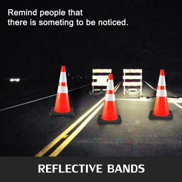 VEVOR traffic cones with reflective bands on a dark road.