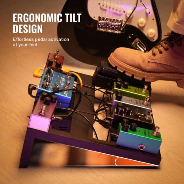 ergonomic tilt VEVOR guitar pedal board with foot activating colorful pedal effects near electric guitar.