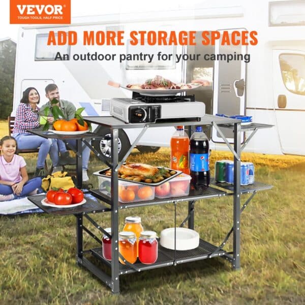 VEVOR camping kitchen table with various food items and beverages in front of an rv.