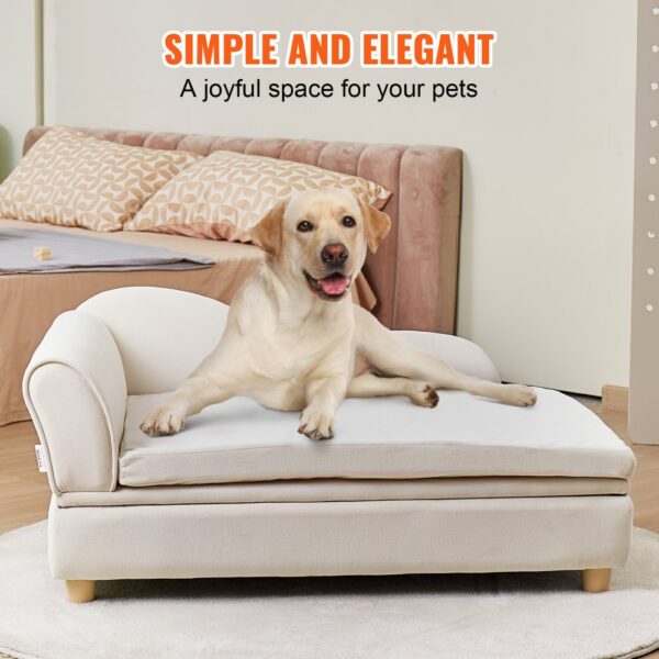 dog enjoying comfort on VEVOR pet sofa, placed in a stylish bedroom with a bed and decorative pillows.