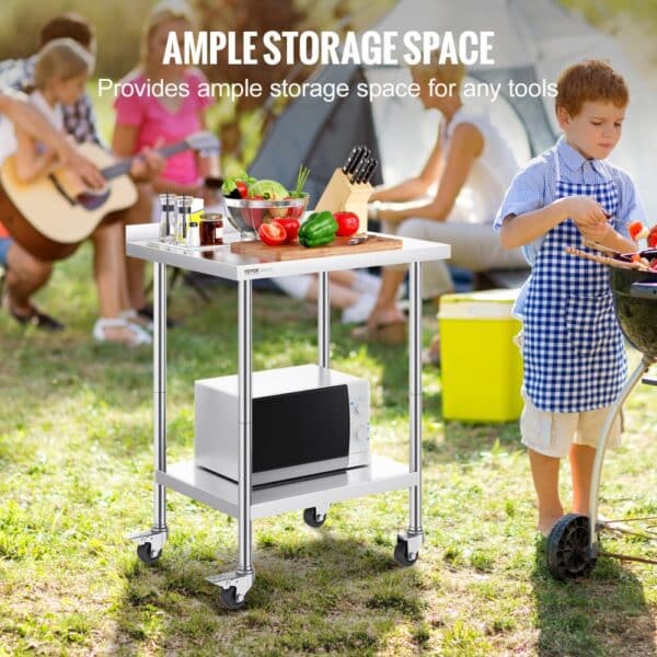 outdoor picnic scene featuring a VEVOR stainless steel work table with vegetables and a microwave.