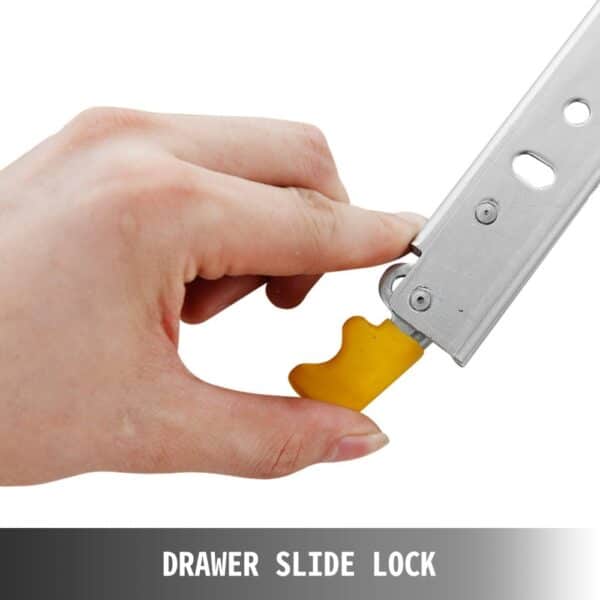 hand engaging VEVOR heavy duty drawer slide lock with yellow handle for secure closure.