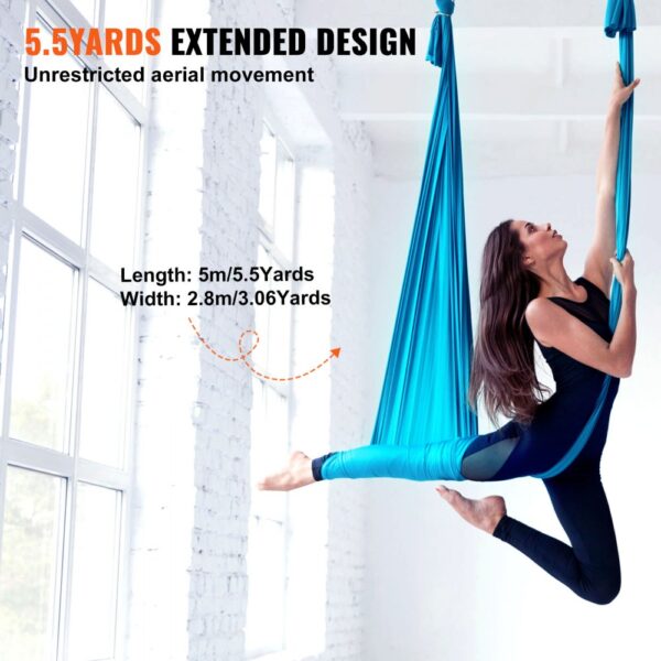 woman exercising with VEVOR aerial yoga hammock; extended design offering unrestricted aerial movement.