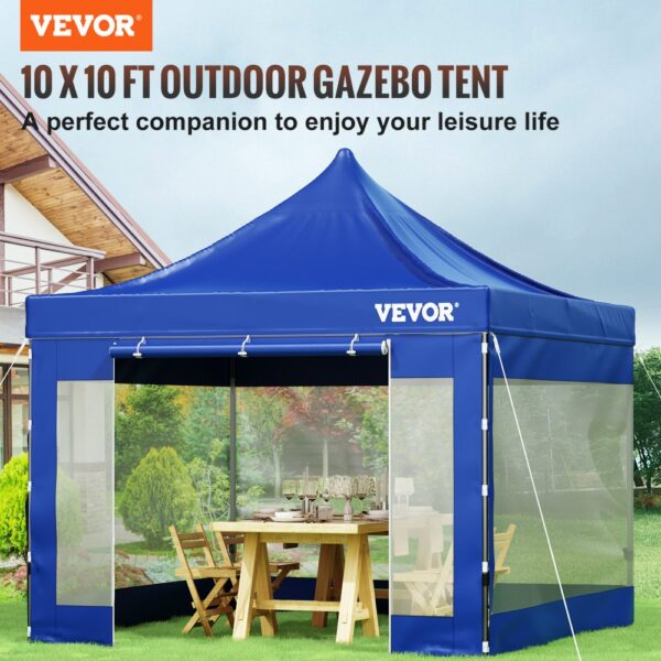 blue VEVOR pop up canopy tent with mesh sides, outdoor setting, wooden table, and chairs inside.