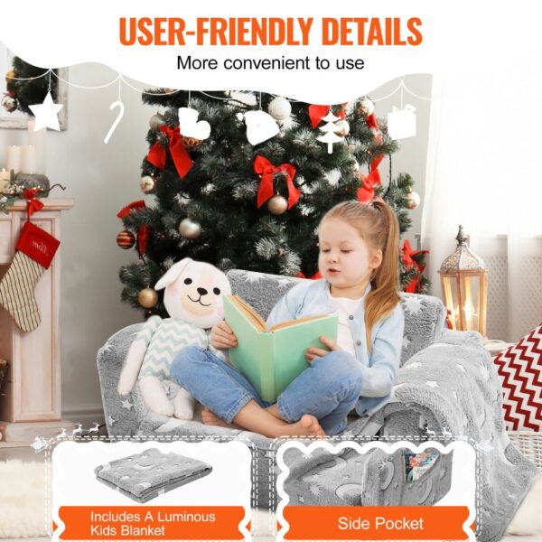 child reading on the VEVOR kids sofa with a plush toy, near a decorated christmas tree. includes blanket.