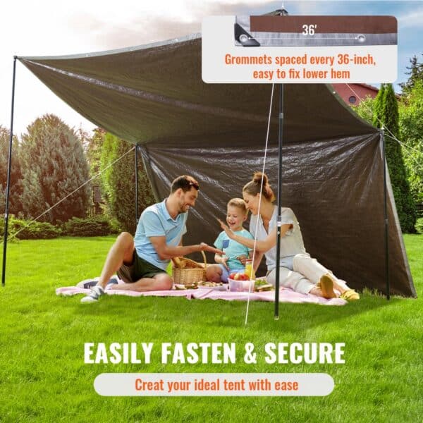 family enjoying a picnic under VEVOR tarp tent in a lush garden. easily fasten & secure with 36-inch grommets.