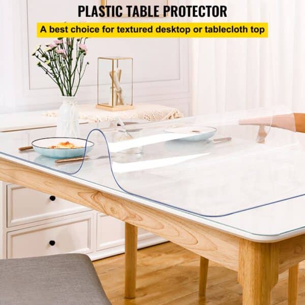 VEVOR clear table protector on a wooden dining table with dishes and a vase of flowers in a bright room.