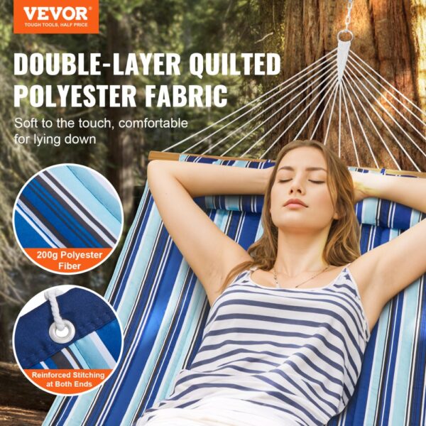 relaxing on a VEVOR double hammock with double-layer quilted polyester fabric in a forest.