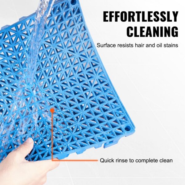 blue VEVOR interlocking drainage tiles being easily rinsed, showcasing effortless cleaning and hair/oil resistance.