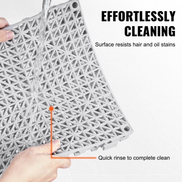 VEVOR modular interlocking cushion being rinsed under water, showing its easy-to-clean surface.