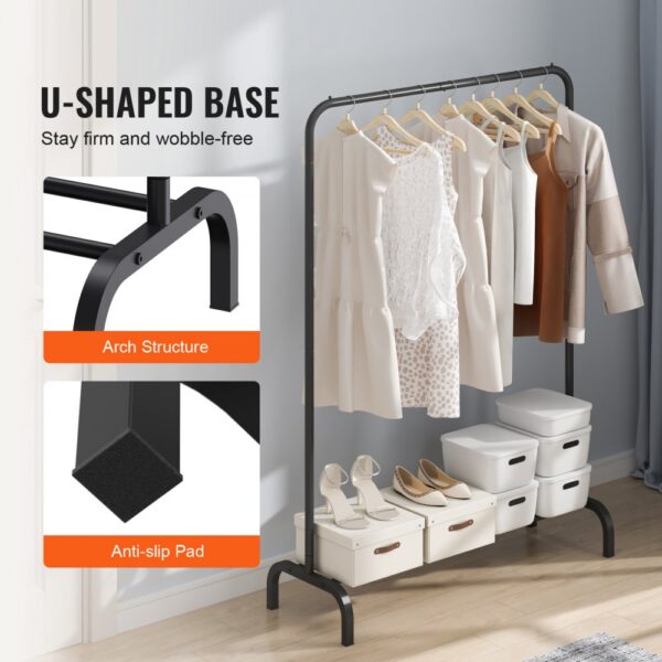 VEVOR clothes rack with u-shaped base, dresses, shoes, and storage boxes on the wooden floor and tidy room.