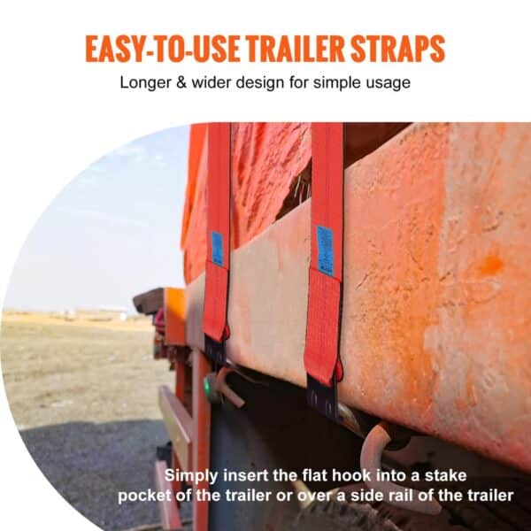 trailer with VEVOR winch straps secured to side rail, showcasing long red straps and flat hooks.