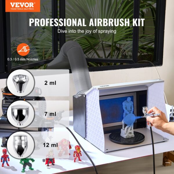 VEVOR airbrush kit displayed on a table, highlighting three nozzle sizes with various painted figures.