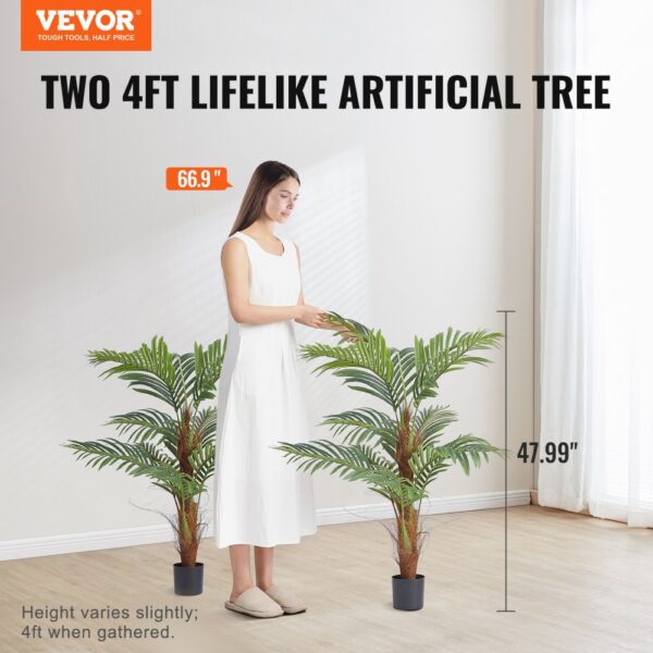 VEVOR artificial palm tree - two 4ft lifelike trees with a woman in white dress.