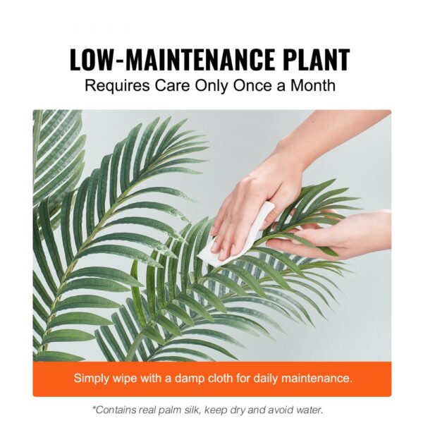 hand cleaning VEVOR artificial palm tree leaves, with low-maintenance care instructions.