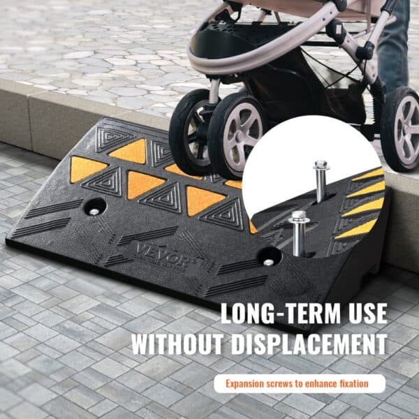 stroller on VEVOR rubber curb ramp with yellow patterns, secured by expansion screws for long-term use.