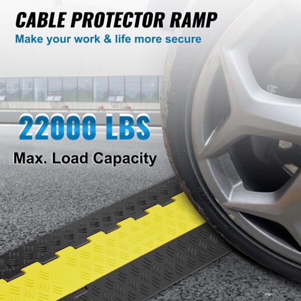 VEVOR cable protector ramp with 22000 lbs max load capacity under a car wheel on a paved surface.