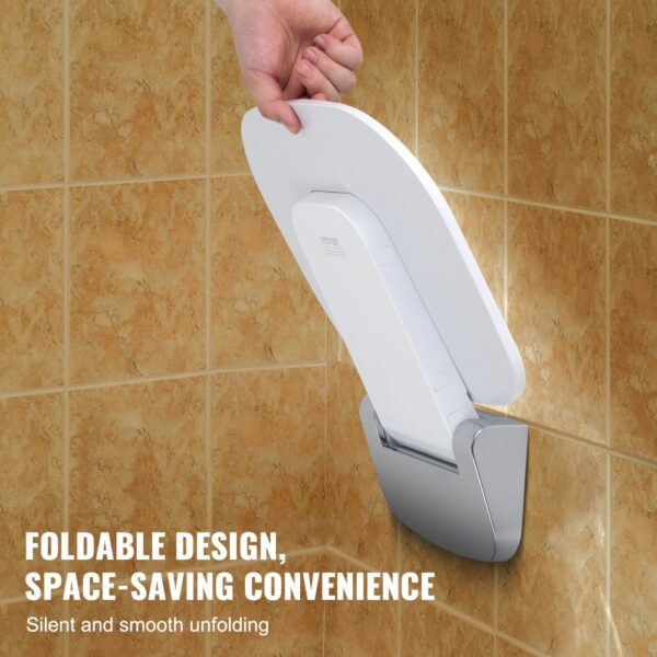 hand folding VEVOR folding shower seat against beige tile wall, highlighting space-saving convenience.