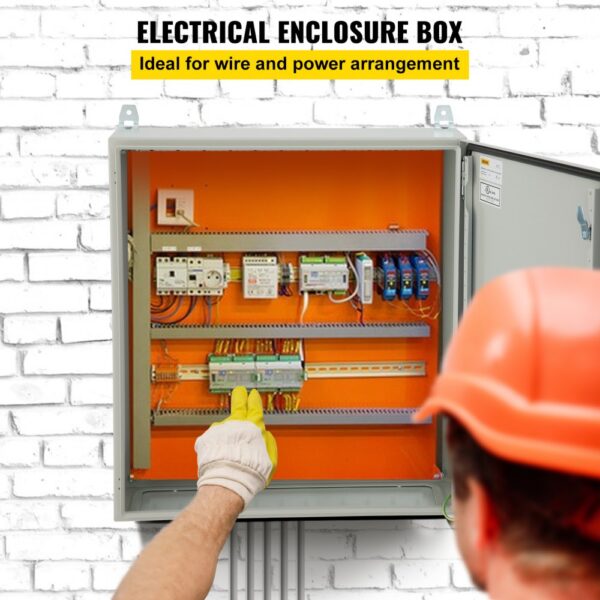 VEVOR electrical enclosure open against brick wall, gloves point inside, showcasing wiring and components.