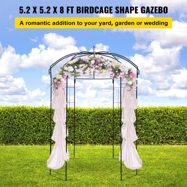 VEVOR garden arbor: birdcage shape with floral decor, green hedge, and blue sky backdrop.