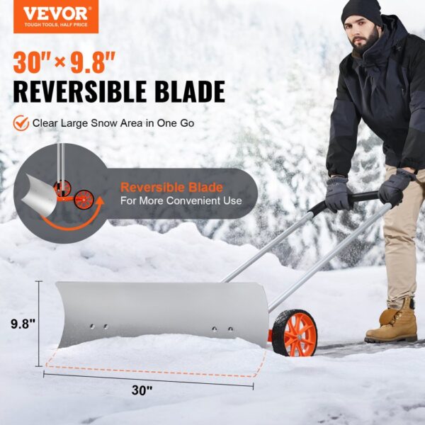 VEVOR snow shovel with 30" x 9.8" reversible blade, red wheels, and man clearing snow in a winter setting.