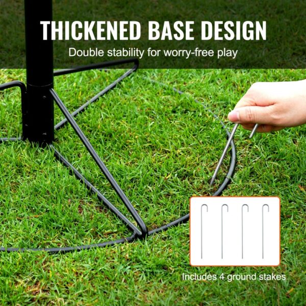 thickened base of VEVOR disc golf basket with four ground stakes for double stability on grass.