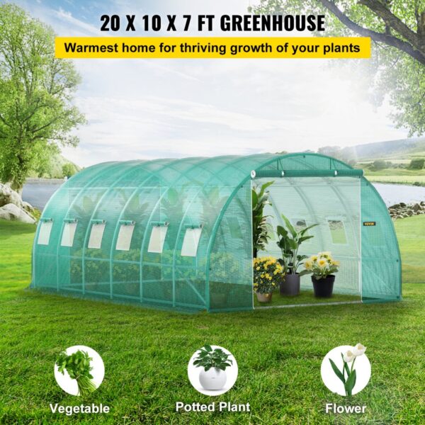 VEVOR walk-in tunnel greenhouse, 20x10x7 ft, with potted plants and flowers on a lush green landscape.