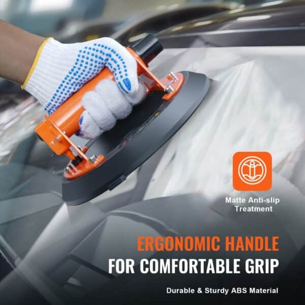 hand holding VEVOR glass suction cup with ergonomic handle for a comfortable grip on a car windshield.