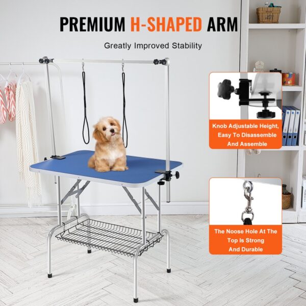 VEVOR pet grooming table with adjustable h-shaped arm and a small dog sitting on the blue surface.