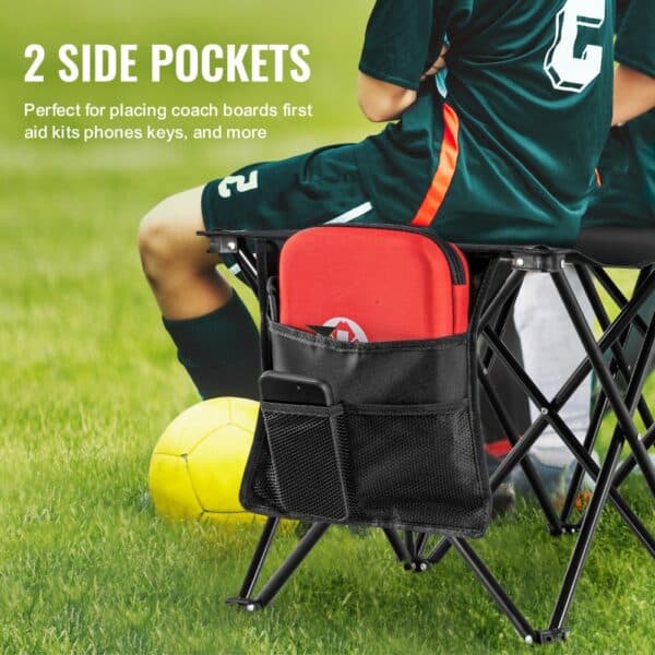 soccer player seated on a VEVOR portable folding sport bench with 2 side pockets holding gear.