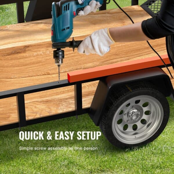 assembling VEVOR trailer tailgate lift assist using a drill on a wooden bed with quick and easy setup.