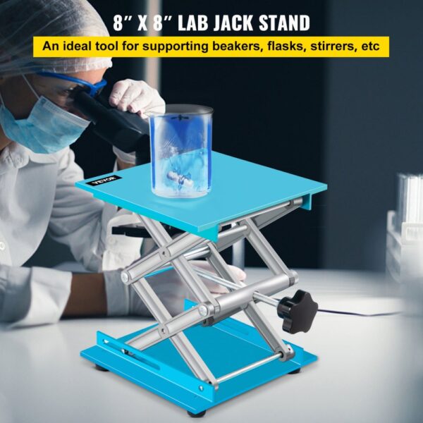 VEVOR lab jack stand supporting a beaker with blue liquid beside a scientist using a microscope.